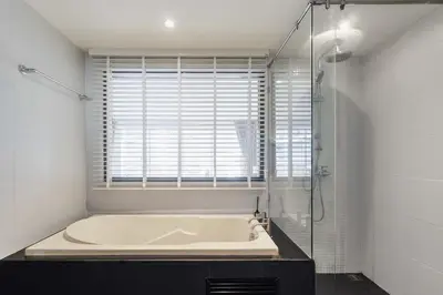 a bath tub in a bathroom with a window at C229 1BR Studio Sea View 850m to Beach Gym in Patong Beach