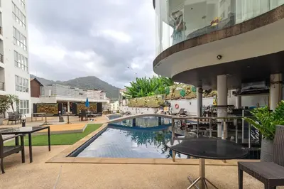 a pool in the middle of a building at C229 1BR Studio Sea View 850m to Beach Gym in Patong Beach