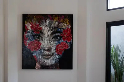 a painting of a woman with flowers in her face at Andaman Paradise 1 - Luxury 3-Bedrooms Pool Villa in Rawai Beach