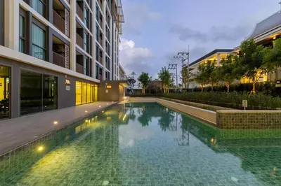 a swimming pool in the middle of a building at C231 Brand-New 1BR Prime Spot Pool&Gym Near Beach in Bang Tao Beach