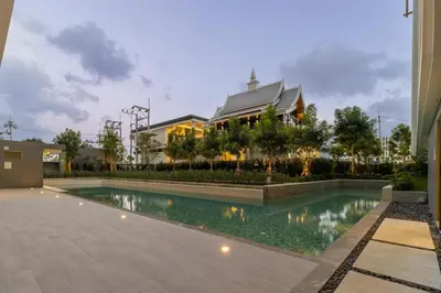 a swimming pool in front of a building at C226 Brand-New Top Location Near Beach Clubs in Bang Tao Beach