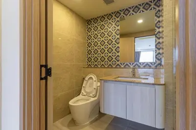 a bathroom with a toilet and a sink and a mirror at C226 Brand-New Top Location Near Beach Clubs in Bang Tao Beach