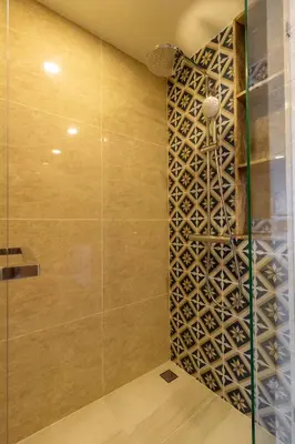 a shower with a wall of wine bottles at C227 Brand New Condo Near Top Phuket Beach Clubs in Bang Tao Beach