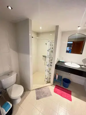 a bathroom with a toilet and a sink and a shower at Rawai Condominium in Ban Saiyuan (1)