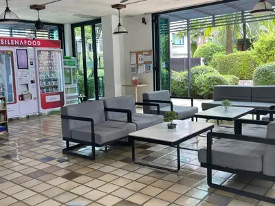 a store with couches and tables and a gas station at The Title Rawai Aparthotel by HSS in Rawai Beach