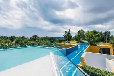 an image of a swimming pool at a resort at Beachside 1 BR apartment by NLA in Bang Tao Beach