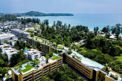 an aerial view of a resort with the ocean at Beachside 1 BR apartment by NLA in Bang Tao Beach