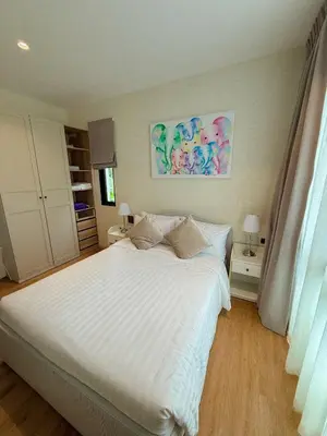 a bedroom with a large white bed with white sheets at FAMILY HOMES - Brand New 2BDRM Poolside Apartment in Phuket