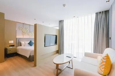 a hotel room with a bed and a couch at Stylish studio on Rawai beach in Rawai Beach