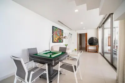 a dining room with a poker table and chairs at Kamala Beach Front Sea View 6 Bedroom Villa in Kamala Beach