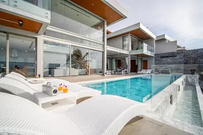 an image of a house with a swimming pool at Kamala Beach Front Sea View 6 Bedroom Villa in Kamala Beach