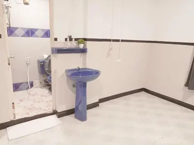 a bathroom with a blue sink and a shower at XX Mitr Inn Phuket Oldtown in Phuket Town