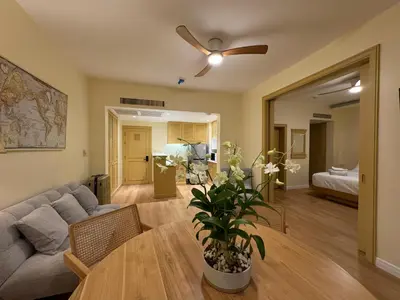 a living room with a couch and a table at Cozy 1 BR Allamanda Laguna Phuket in Laguna Phuket
