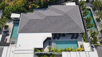 an aerial view of a white house with a swimming pool at Andaman Paradise 2 Luxury 4 Bedrooms Pool Villa in Rawai Beach