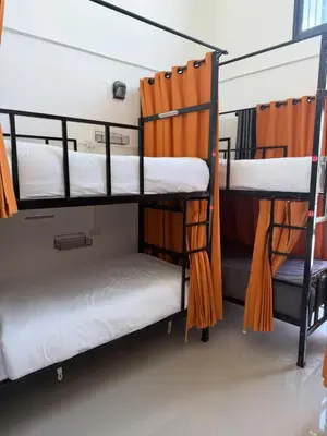 a group of bunk beds in a room at Global Beach Hostel - Ao Nang in Ban Khlong Haeng