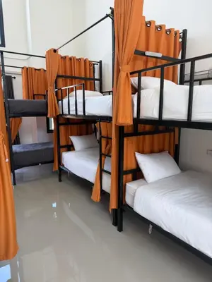 a group of bunk beds in a room at Global Beach Hostel - Ao Nang in Ban Khlong Haeng