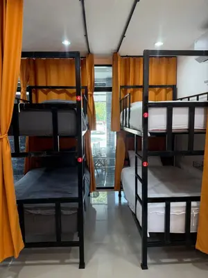 a group of bunk beds in a room at Global Beach Hostel - Ao Nang in Ban Khlong Haeng