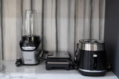 a blender and a toaster sitting on a counter at Andaman Paradise 3 - Luxury 4 Bedrooms Pool Villa in Rawai Beach