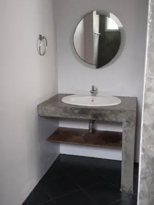 a bathroom with a sink and a mirror at Hillside 3 Bedroom Vacation Home with Pool in Kamala Beach