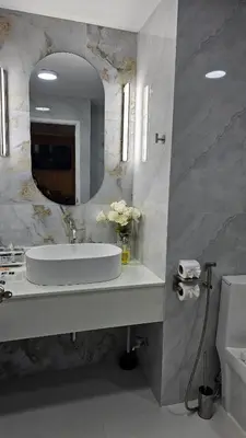 a bathroom with a sink and a mirror at Patong Tower 2 Bedroom Sea View 8 Floor in Patong Beach