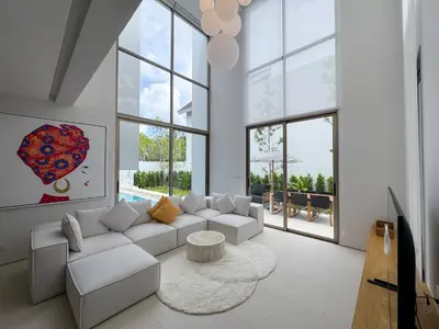 a living room with a white couch and a table at Sumptuous Duplex Pool Villa 3BR in Newly Built LuxPride 4 L12 Residence in Bang Tao Beach