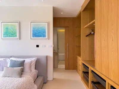 a bedroom with a couch and a bed in a room at Sumptuous Duplex Pool Villa 3BR in Newly Built LuxPride 4 L12 Residence in Bang Tao Beach
