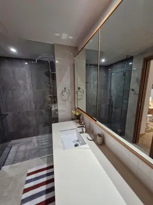 a bathroom with a sink and a shower at Laguna Song in Bang Tao Beach