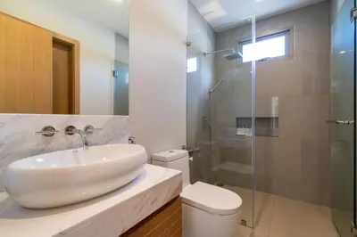 a bathroom with a sink and a toilet and a shower at Trichada Tropical - 3 Bedrooms Pool Villa in Laguna Phuket