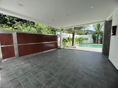 an empty house with a patio and a swimming pool at Joy Villa - Luxury 4 bedroom villa in Ban Saiyuan (1)