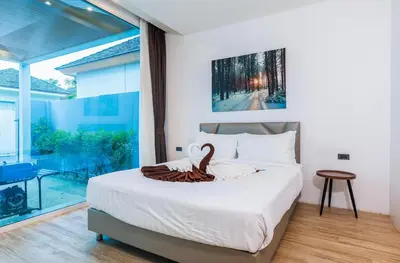a bedroom with a bed with a swan decoration on it at Lilly Villa - 2 Bedrooms Villa with Private Pool in Rawai Beach