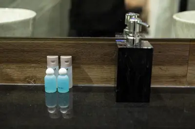 two toothbrushes sitting on a counter in front of a mirror at Lynn Villa - 3 Bedrooms with Private Pool in Rawai Beach