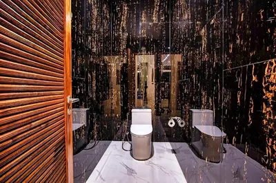 a bathroom with a toilet and a sink at Palm Villa - Spacious 4 Bedrooms with Private Pool in Rawai Beach