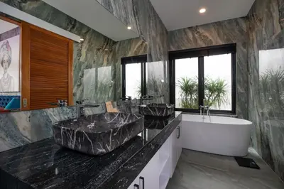 a bathroom with two sinks and a bath tub at Pattana Moon - Luxury Calm 4 Bedrooms Pool Villa in Ban Saiyuan (1)