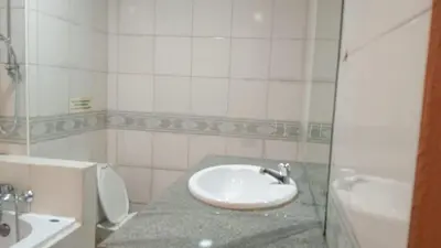 a bathroom with a sink and a toilet at Haweli Restaurant & Guest House in Ao Nang Beach