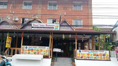 a building with a food stand in front of it at Haweli Restaurant & Guest House in Ao Nang Beach