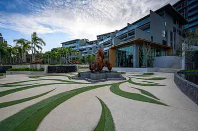 a sculpture in front of a building with a statue at Deluxe Surin apartment with washer and fast WIFI in Surin Beach