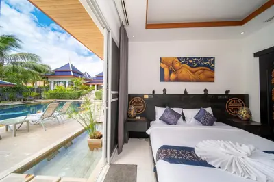 a bedroom with a bed and a balcony with a pool at Luxurious 8bedroom villa in Bangtao Large private pool Group vacation villa Free maid and private kitchen service Extended in Bang Tao Beach