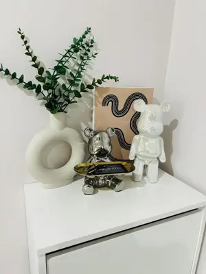 a shelf with a vase and a toilet on a dresser at Cen 1 bed room861 in Phuket Town