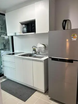 a kitchen with a sink and a refrigerator at Cen 1 bed room861 in Phuket Town
