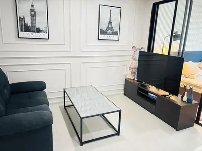 a living room with a couch and a tv at Cen 1 bed room861 in Phuket Town