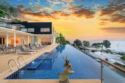 a house on the beach with a swimming pool at The bay Cape Yamu Villa 10 in Phuket Town