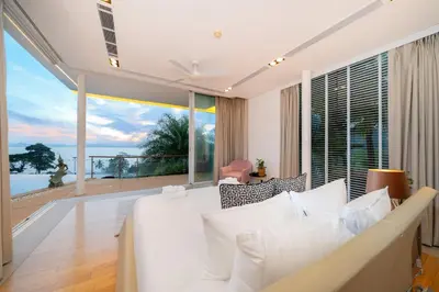 a bedroom with a bed and a large window at The bay Cape Yamu Villa 10 in Phuket Town