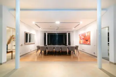 a dining room with a table and chairs at The bay Cape Yamu Villa 10 in Phuket Town