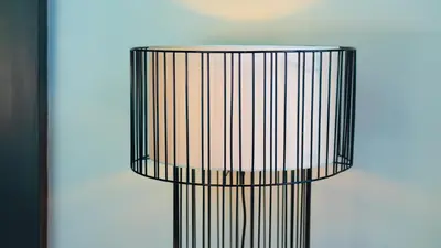 a black bird cage sitting next to a wall at Bangtao Beach 3 bedroom private pool villa in a quiet area near Boat Avenue mono wings in Bang Tao Beach