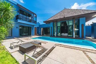 a villa with a swimming pool and a house at Bangtao Beach 3 bedroom private pool villa in a quiet area near Boat Avenue mono wings in Bang Tao Beach