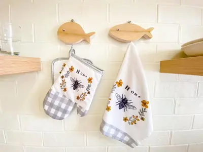 a couple of towels hanging on a kitchen wall at Luxury Condo Near Patong Beach & Shopping Mall in Kathu