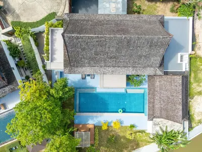 an overhead view of a house with a swimming pool at Bang Tao 6-bedroom large private pool modern Balinese style leisure holiday villa BBQ family group the park in Bang Tao Beach