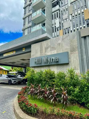 a building with a sign that reads hil mgma at Beachside Bliss 2- Bed HM612 in Phuket Town