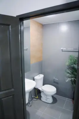 a bathroom with a toilet and a sink at Beachside Bliss 2- Bed HM612 in Phuket Town