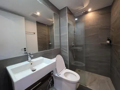 a bathroom with a sink and a toilet and a shower at Island Drift Studio T3-332 in Chalong